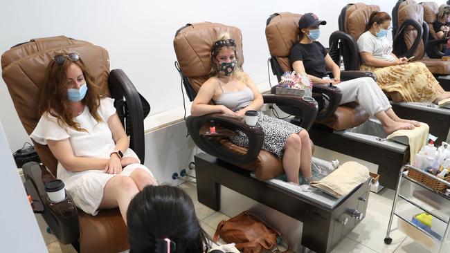 Melburnians celebrate a return to COVID-normal life, with beauty salons like this one in South Yarra back in business on Wednesday. Picture: David Crosling