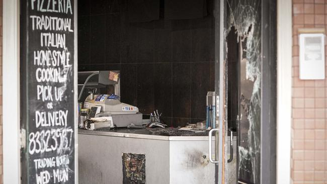 Inside the burnt-out shop. Picture: AAP/Mike Burton