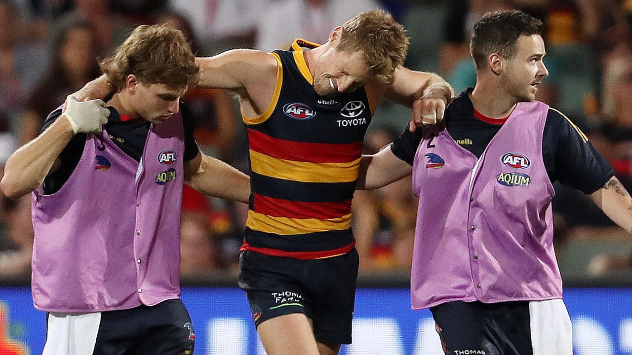 ADELAIDE, AUSTRALIA – APRIL 16: Rory Sloane of the Crows comes off with a suspected ACL during the 2022 AFL Round 05 match between the Adelaide Crows and the Richmond Tigers at Adelaide Oval on April 16, 2022 In Adelaide, Australia. (Photo by Sarah Reed/AFL Photos via Getty Images)