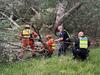 Moment woman, dog rescued from river