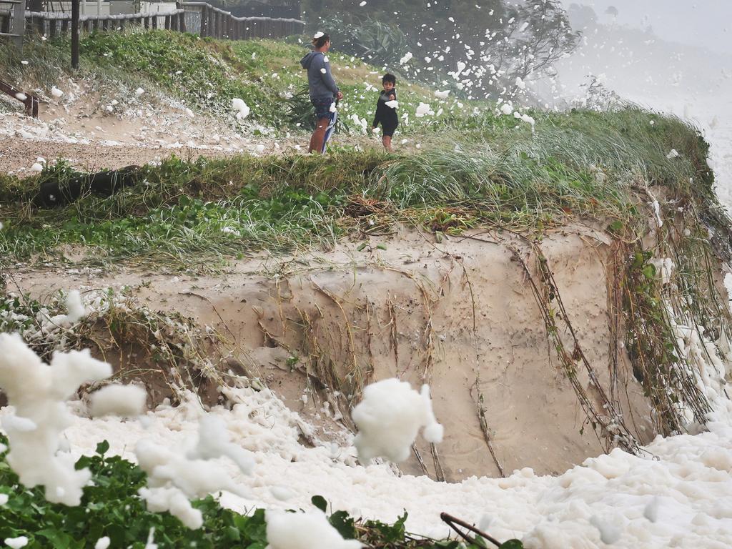 Erosion and foam make for a spectacle at Main Beach. Picture Glenn Hampson