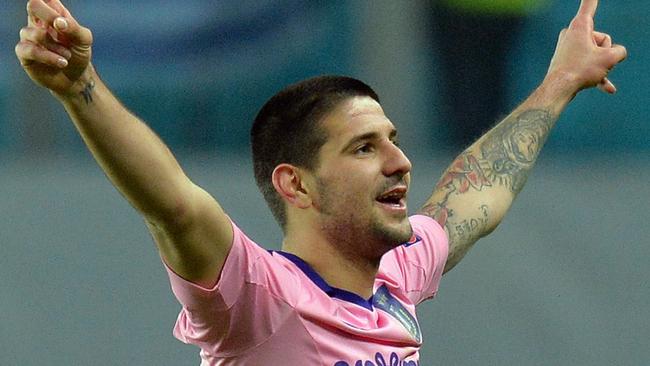 (FILES) A file photo taken on February 26, 2015, shows RSC Anderlecht's Serbian forward Aleksandar Mitrovic as he celebrates after scoring a goal during the UEFA Europa League round of 32 match between FC Dinamo Moscow and RSC Anderlecht in Khimki outside Moscow. Serbia striker Aleksandar Mitrovic has joined Newcastle on a five-year contract the English Premier League club announced July 21, 2015. The 20-year-old will arrive at St James' Park from Belgian side Anderlecht, subject to visa clearance, for an undisclosed fee but in what Newcastle said was the fourth-biggest deal in their history. AFP PHOTO / YURI KADOBNOV / FILES