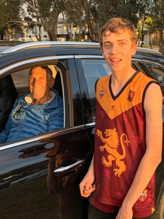 Port Adelaide legend Russell Ebert and grandson Albert Ebert. Russell watched on from the car on Sunday as Albert kicked 16 goals for SMOSH West Lakes in an under-15 match. Picture: SMOSH West Lakes Football Club