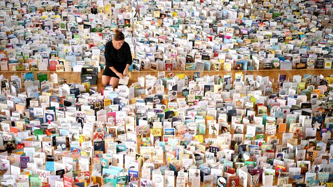 Mandy Alison adds to the thousands of birthday cards sent to Sir Tom for his 100th birthday. Picture: Getty Images