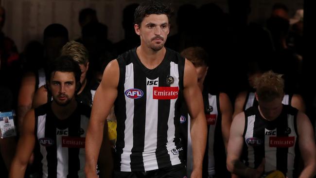 Collingwood players have apologised for past racism issues at the club.