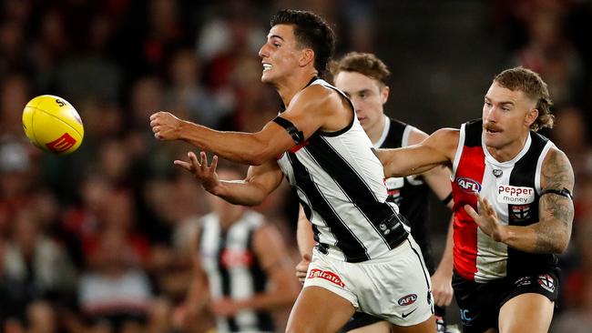 Collingwood’s Nick Daicos handpasses the ball as he is about to be tackled by St Kilda’s Dean Kent last year. Picture: Dylan Burns/AFL Photos via Getty