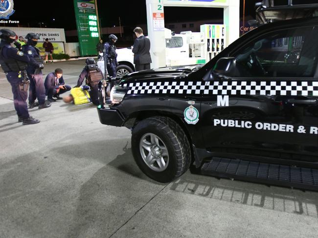 The man was arrested Tuesday morning after stopping for petrol at the BP Service Station in Warrawong.