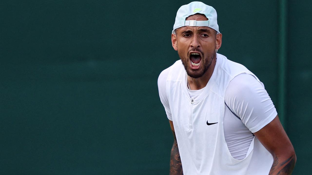 Australia's Nick Kyrgios reacts as he competes against Britain's Paul Jubb during their men's singles tennis match on the second day of the 2022 Wimbledon Championships at The All England Tennis Club in Wimbledon, southwest London, on June 28, 2022. (Photo by Adrian DENNIS / AFP) / RESTRICTED TO EDITORIAL USE