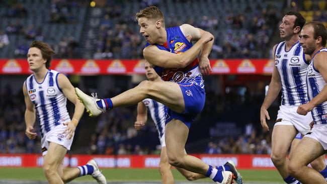 Bulldog Lachie Hunter gets a kick forward against North Melbourne. Picture: Michael Klein