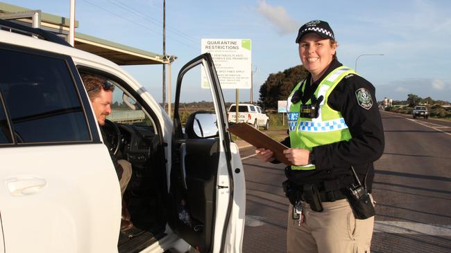 Senior Constable Lisa Burk of Ceduna police chats to Ceduna resident Marcus Tanke at the Ceduna quarantine checkpoint roadblock on Tuesday. Picture: Andrew Brooks