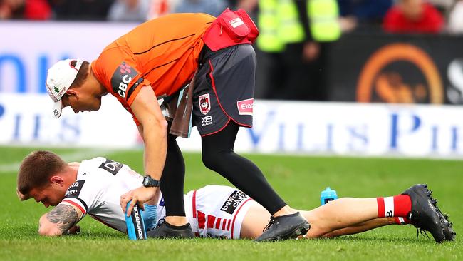 SYDNEY, AUSTRALIA - AUGUST 26: Euan Aitken of the Dragons looks dejected as he receives attention from the trainer during the round 24 NRL match between the St George Illawarra Dragons and the Canterbury Bulldogs at UOW Jubilee Oval on August 26, 2018 in Sydney, Australia. (Photo by Mark Kolbe/Getty Images)