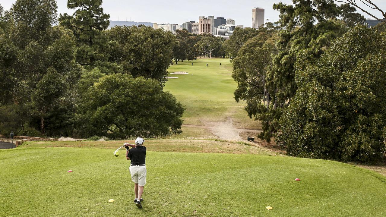 A golfer tees off at North Adelaide Golf Course. Picture: Mike Burton