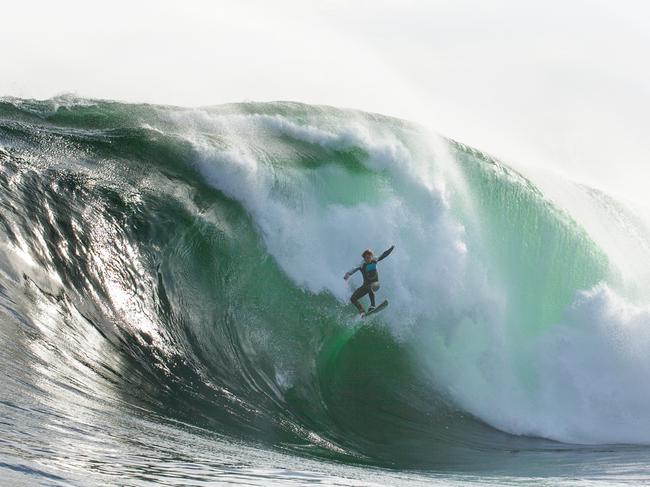 Surfer and author Marti Paradisis taking flight at Shipstern Bluff. Picture: Stu Gibson