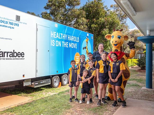 Blackwater North State School students meeting Healthy Harold after a session about positive health, wellness and how their bodies work.