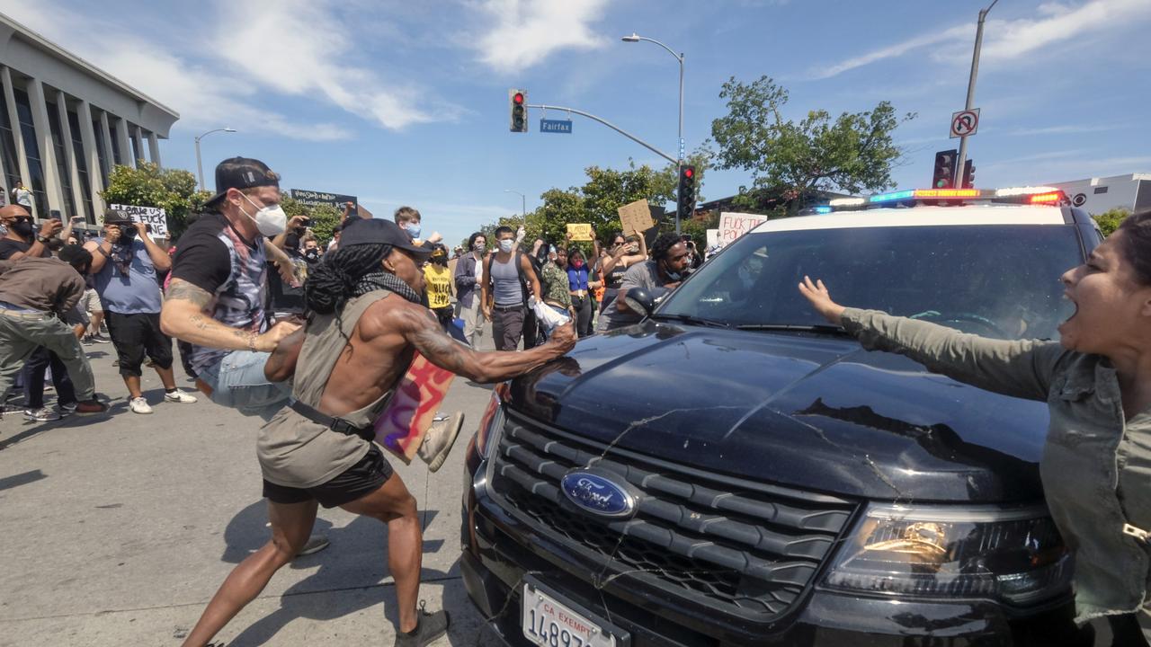 Protests across the country have escalated over the death of George Floyd who died after being restrained by Minneapolis police officers. Picture: AP Photo/Ringo H.W. Chiu