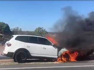 A car on fire on the side of the Warrego Highway. Picture: Contributed