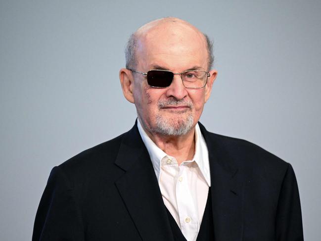 (FILES) British-US author Salman Rushdie poses for photographers as he arrives to address a press conference at The Frankfurt Book Fair in Frankfurt am Main, western Germany on October 20, 2023. British-American author Salman Rushdie releases his memoir "Knife" on April 16, 2024, recounting the harrowing experience of being stabbed at a public event in 2022 and how he overcame the near-fatal ordeal. (Photo by Kirill KUDRYAVTSEV / AFP)