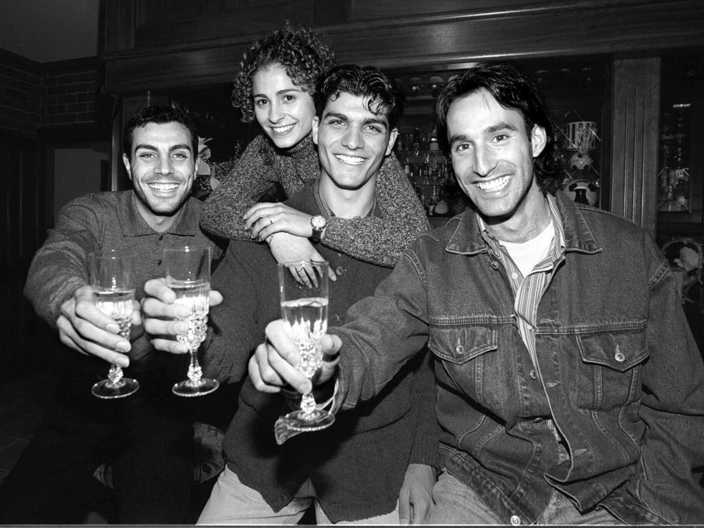 Aurelio Vidmar (right) and Ross Aloisi (left) share a toast with John Aloisi and his wife Angela. Picture: Sarah Reed