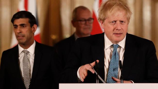 Britain's Chancellor of the Exchequer Rishi Sunak and PM Boris Johnson announce a new stimulus package. Pic: AFP)