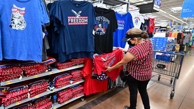 A woman shops for t-shirts in California. Picture: Frederic J. Brown/AFP)