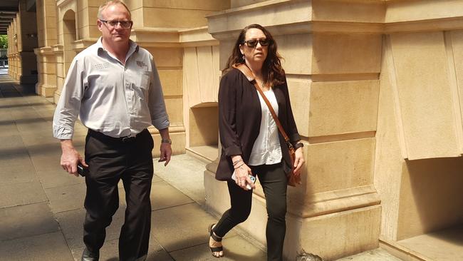 Former NCA personnel officer Joanne Taskas, right, and a supporter leave the Supreme Court following her evidence in the trial of Domenic Perre. Picture: Sean Fewster.