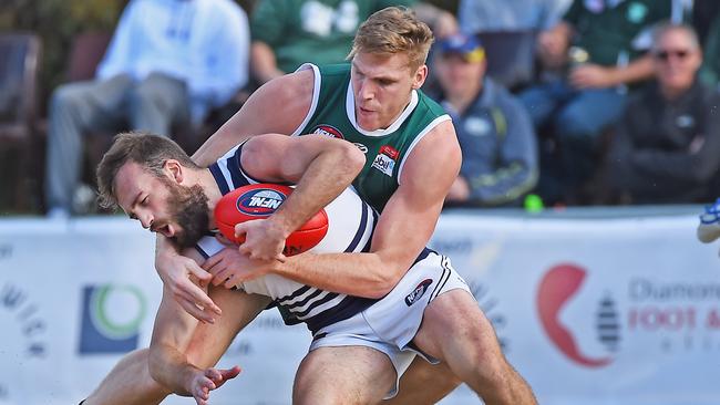 Tom Bell takes down Bundoora captain-coach Andrew Sturgess. Picture: Rob Leeson