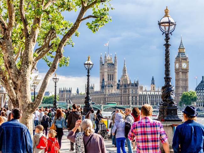 LONDON - JUNE 11, 2011: Crowd of people walking on The Queenâ€™s Walk promenade part of Jubilee Walkway route