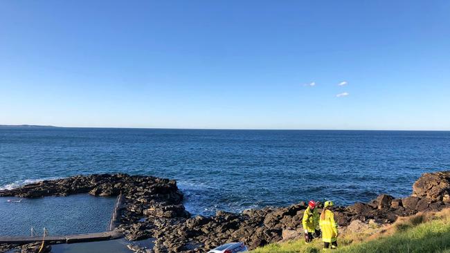 An out of control car sped down a steep rocky cliff near Kiama‘s famous blowhole, south of Sydney on Sunday. Picture: FRNSW