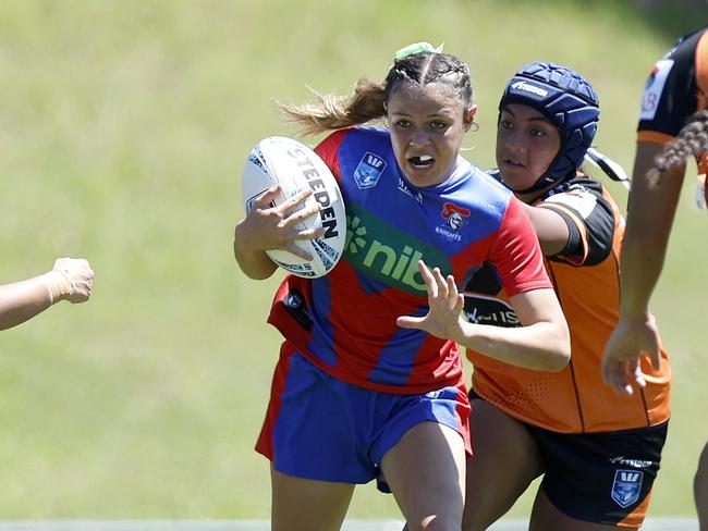 Evie Purukamu gets through a tackle. Picture: Michael Gorton