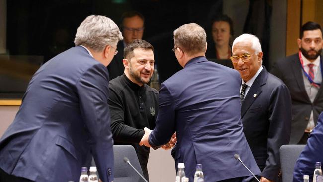 Ukraine's President Volodymyr Zelensky shakes hands with European leaders Picture: AFP