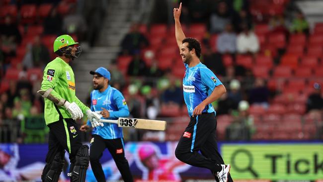 SYDNEY, AUSTRALIA - DECEMBER 16: Wes Agar of the Strikers celebrates dismissing Gurinder Sandhu of the Thunder during the Men's Big Bash League match between the Sydney Thunder and the Adelaide Strikers at Sydney Showground Stadium, on December 16, 2022, in Sydney, Australia. (Photo by Cameron Spencer/Getty Images)