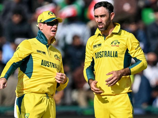 Glenn Maxwell (right) speaks Steve Smith during Australia’s clash with England at this year’s ICC Champions Trophy tournament. Picture: Aamir QURESHI / AFP