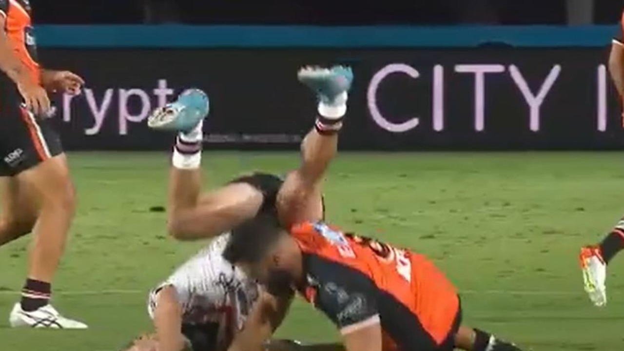 West Tigers co-captain James Tamou rattles into Roosters halfback Sam Walker in a shocking late tackle in the trial at Gosford on Friday night. , supplied Images