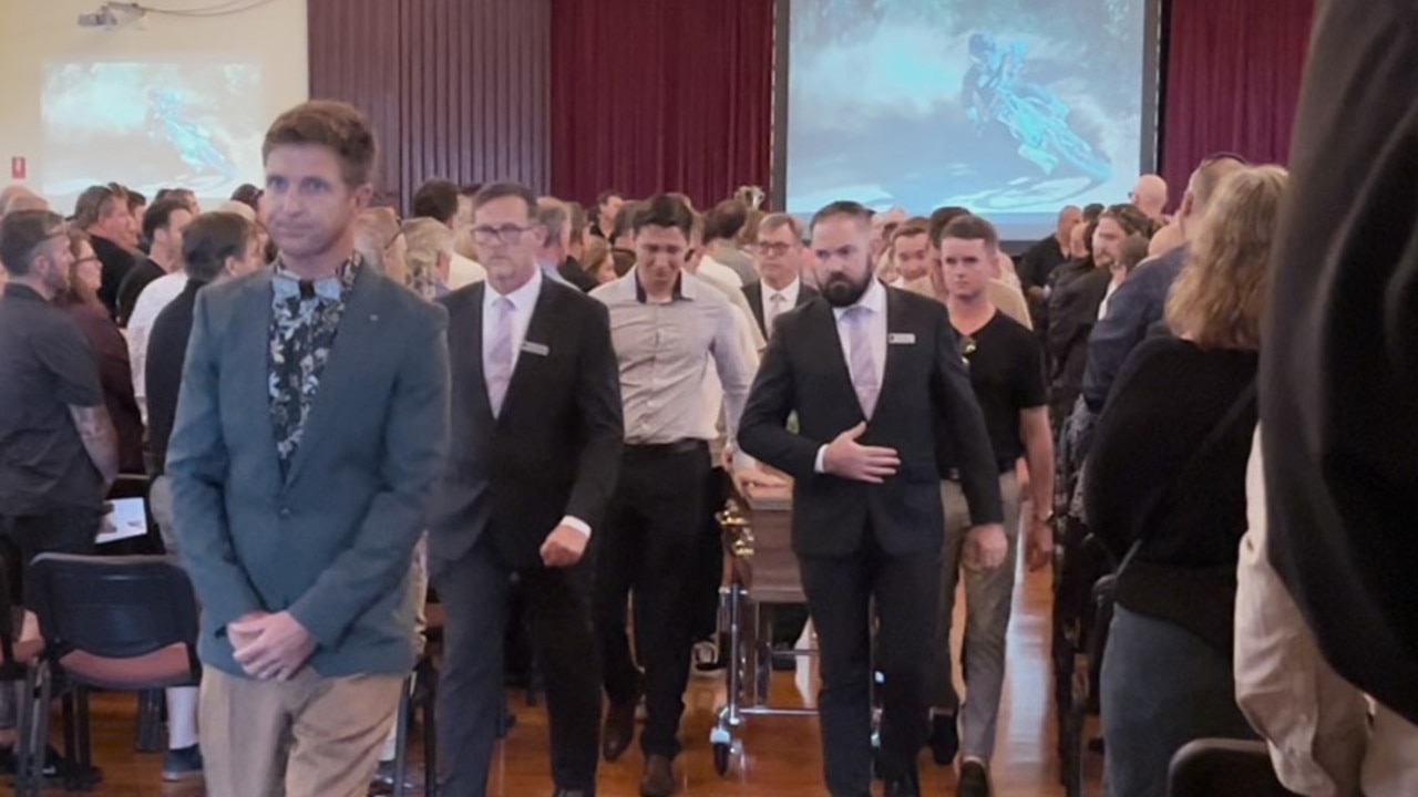 Celebrant Benjamin Carlyle leading the procession, as Joel’s close family and friends follow closely behind.