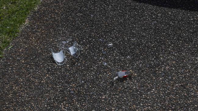 Broken glass bottles found after the incident. Picture: Monique Harmer