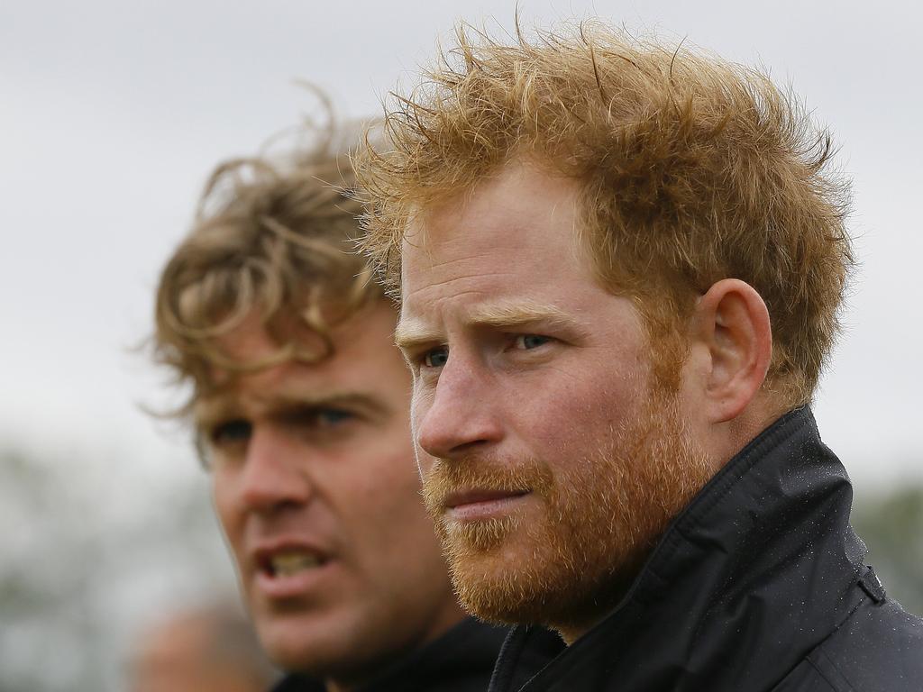 Britain’s Prince Harry walks with Boultbee Flight Academy director Matt Jones, as they pass WWII aircraft at Goodwood Aerodrome in Goodwood, southern England. Picture: AFP