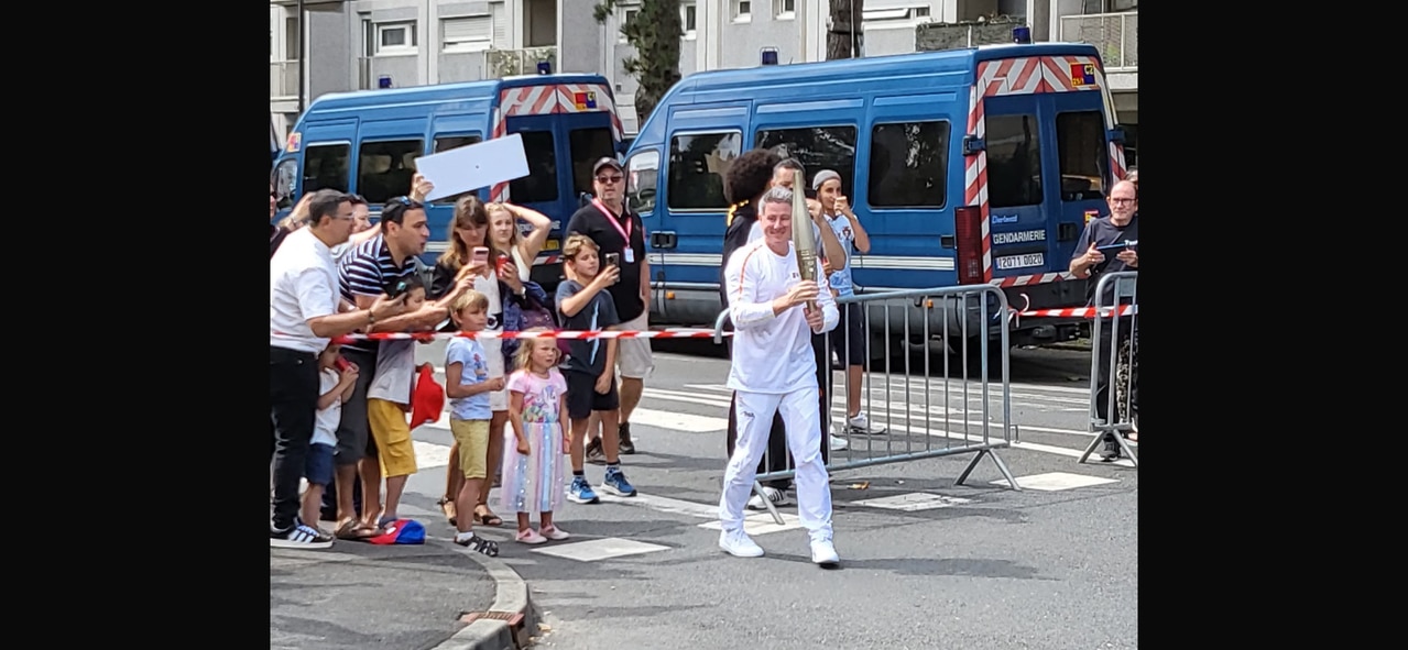 Nine CEO Mike Sneesby broadly smiled as he carried the Olympic torch.