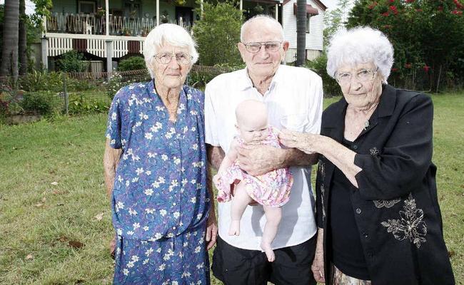 Jenny Kleve, Phillie Kleve and their brother Bob Cochrane with the youngest of the Cochrane clan, two-month-old Ebony Cochrane, outside the family home near Marburg. . Picture: Sarah Harvey