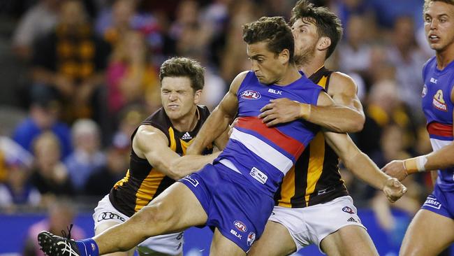 Luke Dahlhaus gets a kick away under pressure. Picture: Michael Klein