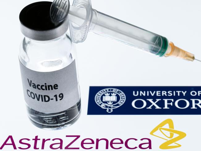 (FILES) This file illustration picture taken in Paris on November 23, 2020 shows a syringe and a bottle reading "Covid-19 Vaccine" next to AstraZeneca company and University of Oxford logos. - The Covid-19 vaccine developed by the British drugs group AstraZeneca and the University of Oxford has achieved a "winning formula" for efficacy, the company's chief executive said on Sunday, December 27. (Photo by JOEL SAGET / AFP)