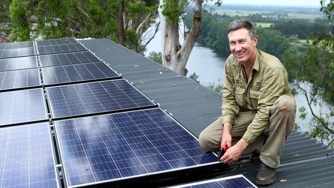 Solar panel installer Rod Grono on a roof in western Sydney. Picture: Hollie Adams