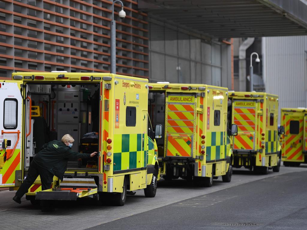 A paramedic works in an ambulance parked outside the Royal London hospital in London on Sunday amid fears wards are running out of beds. Picture: Daniel Leal-Olivas /AFP