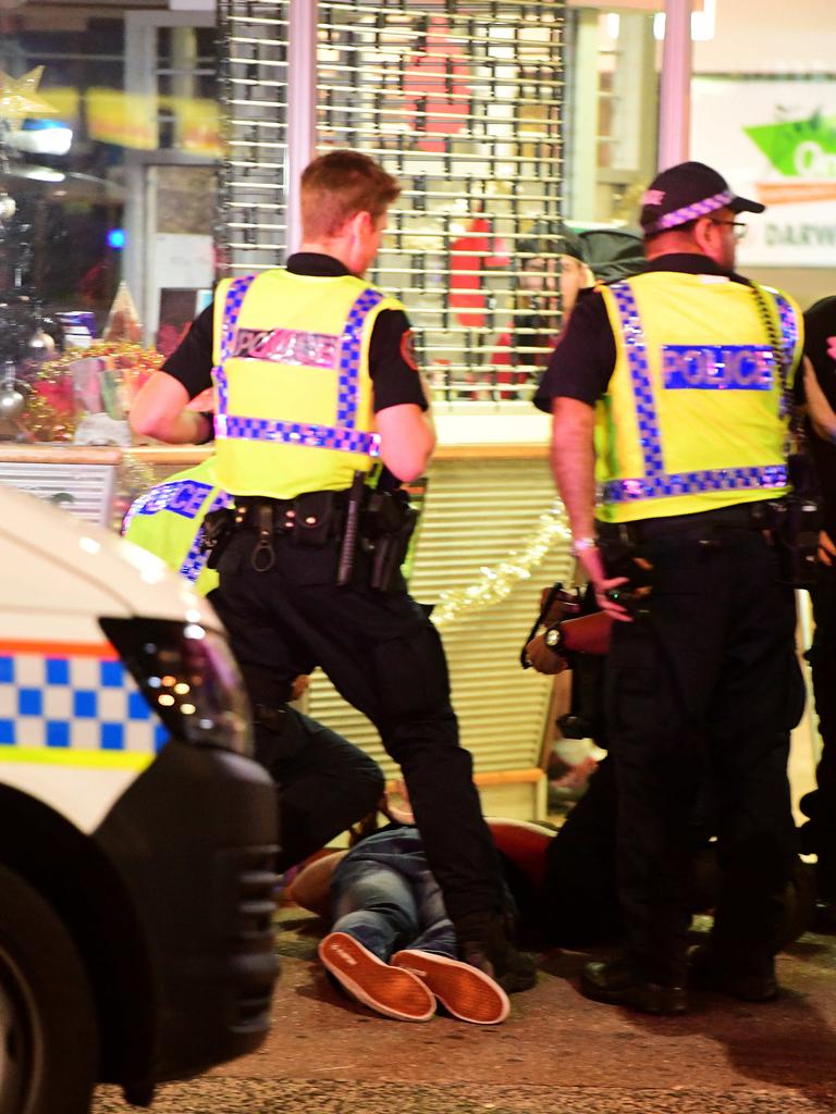 Police officers break up a fight on Mitchell street in the early hours of New Year's day