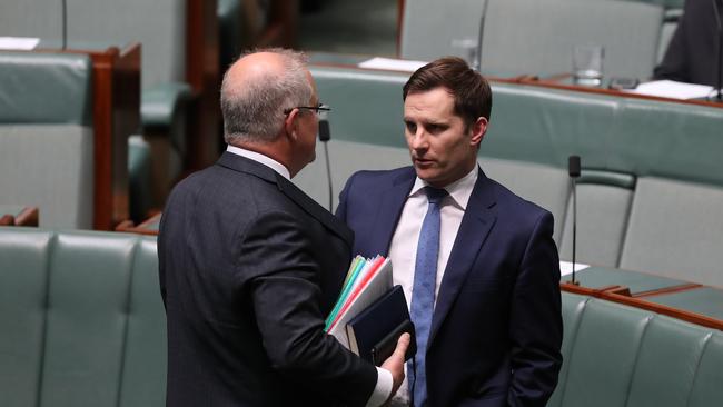 Prime Minister Scott Morrison speaks to Alex Hawke before Question Time in the House of Representatives. Picture: Kym Smith