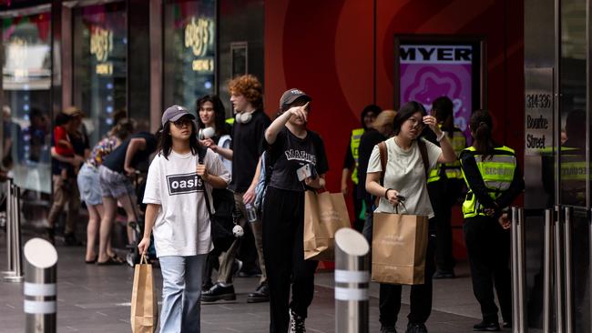 Christmas shoppers carry shopping bags while walking along Bourke Street Mall in Melbourne. Picture: NCA NewsWire / Diego Fedele