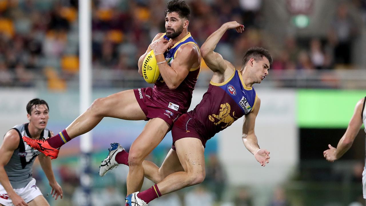 BRISBANE, AUSTRALIA - MAY 01: Marcus Adams of the Lions and Brandon Starcevich collide during the round seven AFL match between the Brisbane Lions and the Port Adelaide Power at The Gabba on May 01, 2021 in Brisbane, Australia. (Photo by Jono Searle/AFL Photos/via Getty Images)