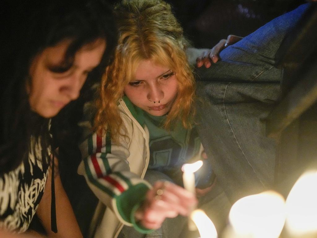 Fans light candles outside the hotel where former One Direction singer Liam Payne was found dead after he fell from a balcony in Buenos Aires, Argentina. Picture: AP