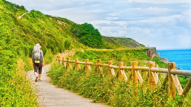 Lonely Pilgrim with backpack walking the Camino de Santiago in Spain, Way of St James.