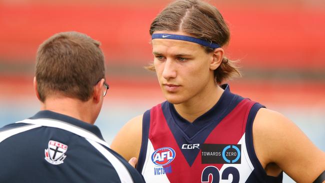 MELBOURNE, VICTORIA — MARCH 26: Devlin Brereton of the Sandringham Dragons, son of Hawthorn Hawks Legend Dermott Brereton, listens to a coach during the 2017 TAC round 01 match between the Oakleigh Chargers and the Sandringham Dragons at Ikon Park on March 26, 2017 in Melbourne, Australia. (Photo by Michael Dodge/AFL Media/Getty Images)