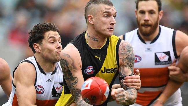 Josh Kelly tackles Dustin Martin. Picture: AAP